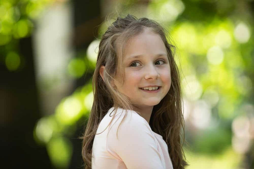 Beautiful young girl smiling at the park