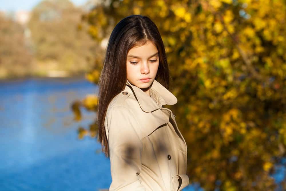 Beautiful young girl in the autumn park