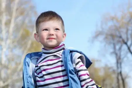 Portrait of adorable little boy in spring park