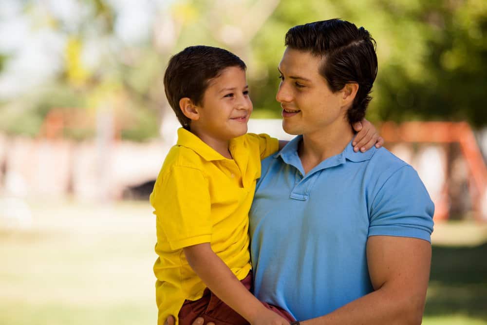 Father looking at child standing. Отец и сын ютуб филиппины