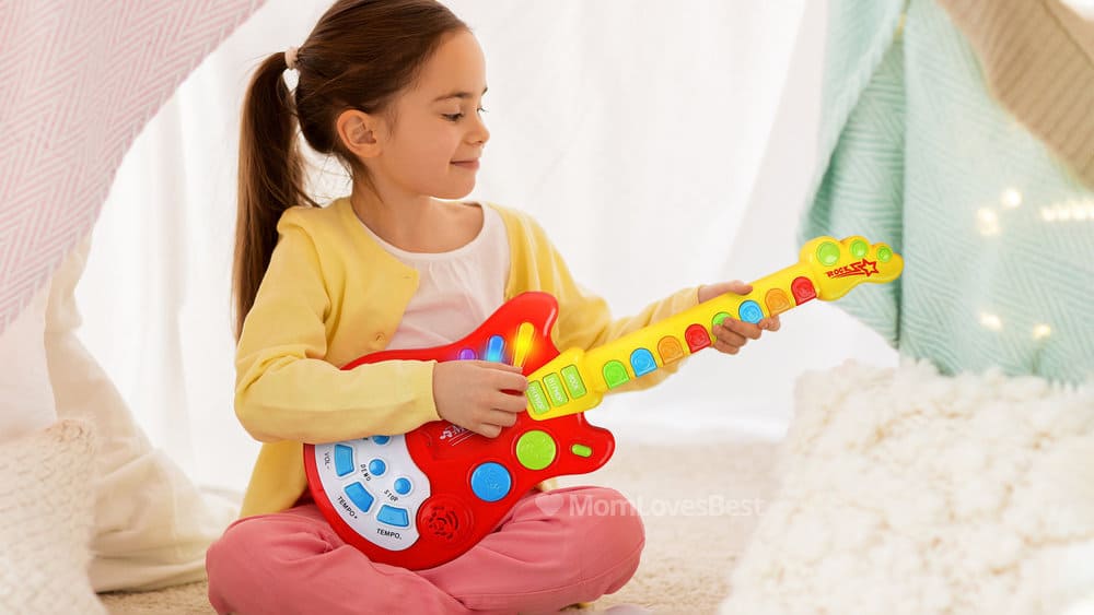 Photo of the Dimple Handheld Electronic Toy Guitar