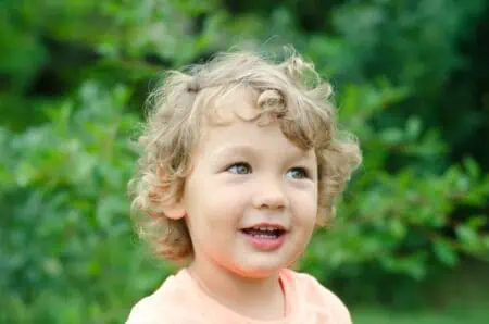 Cute little boy spending time in the park.