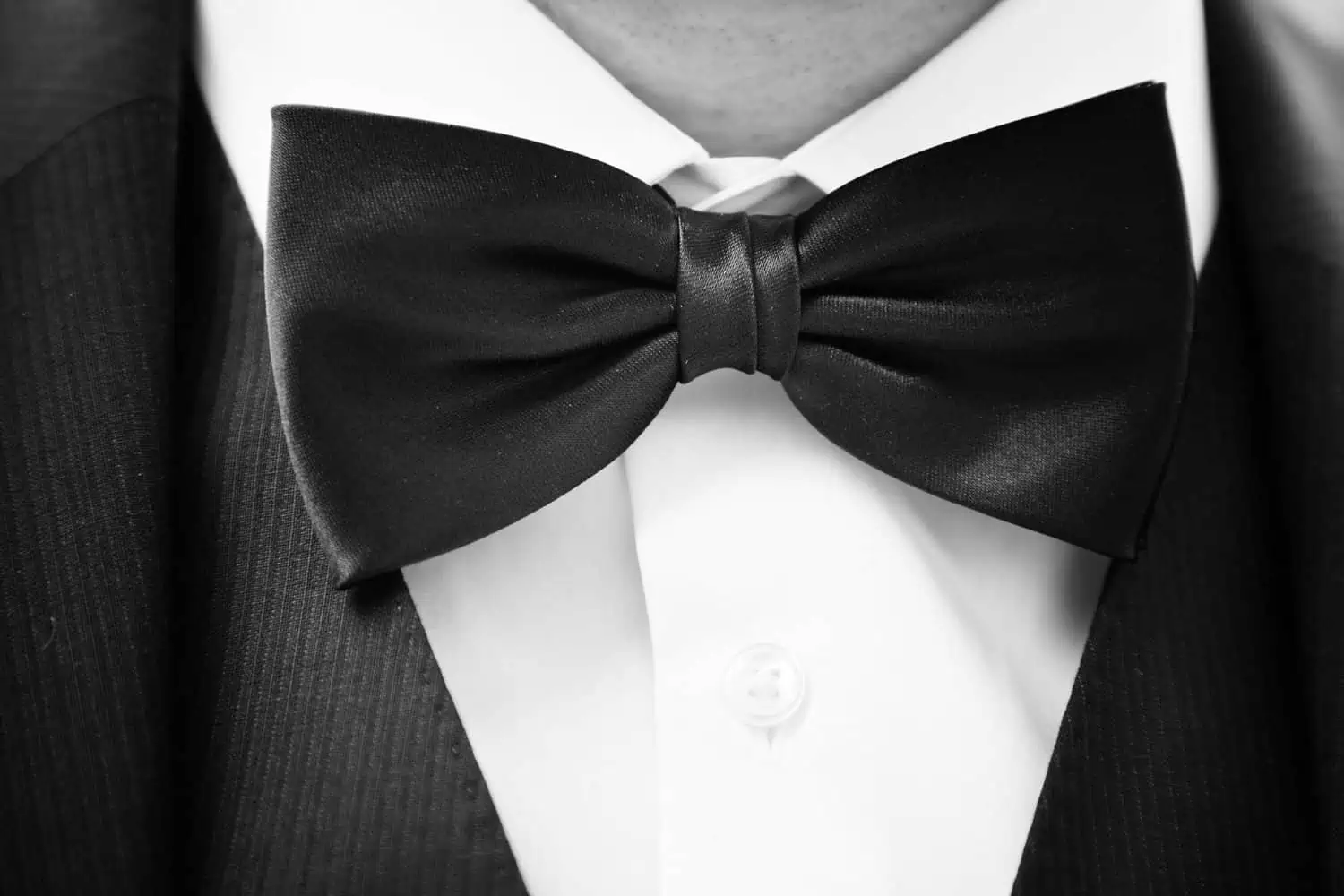 Classy black suit with white inner and bow tie