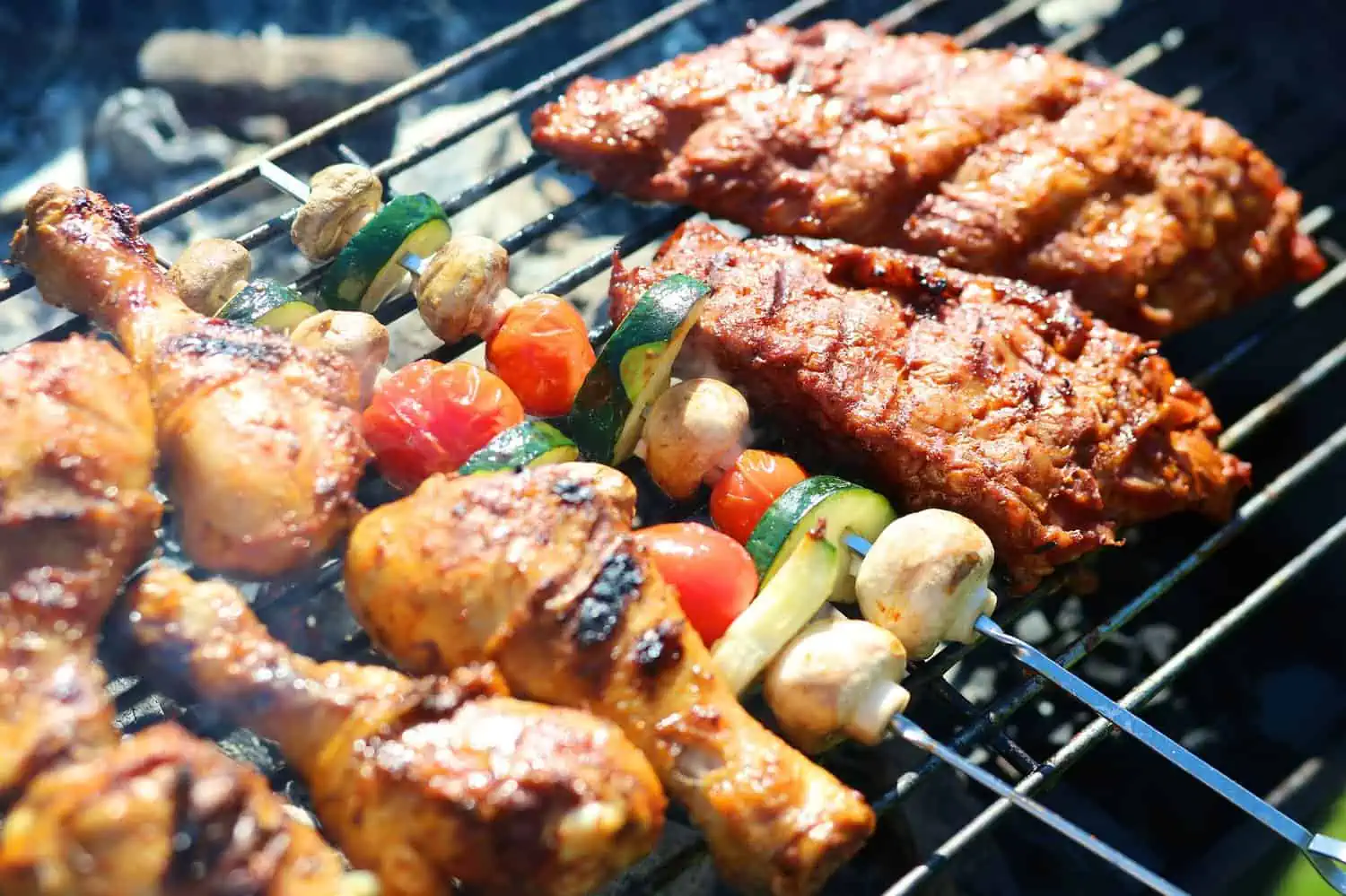 Assorted meat and vegetables on barbecue griller