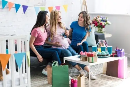 Pregnant mom with female friends during baby shower