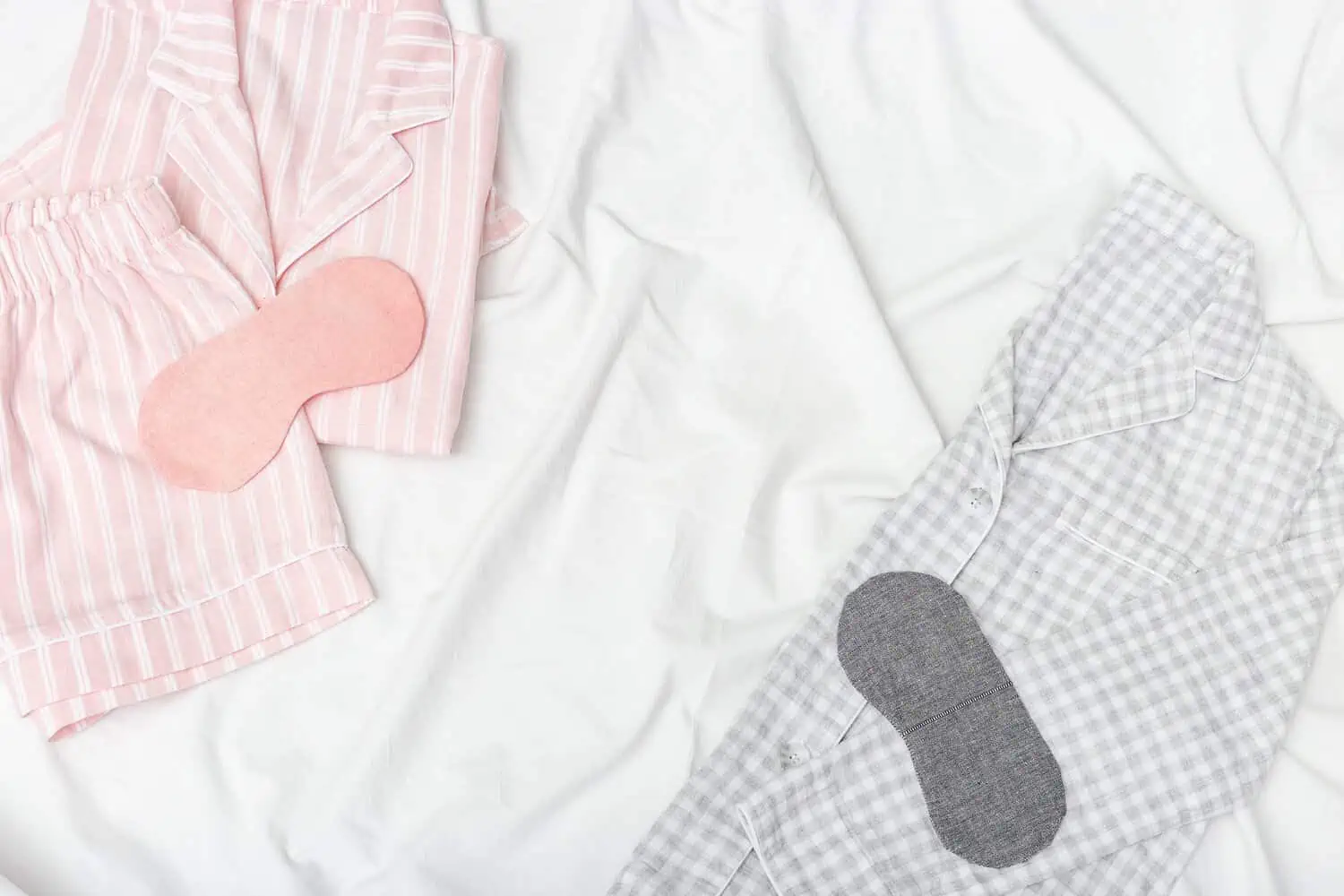 Pink and grey sleepwear on the bed