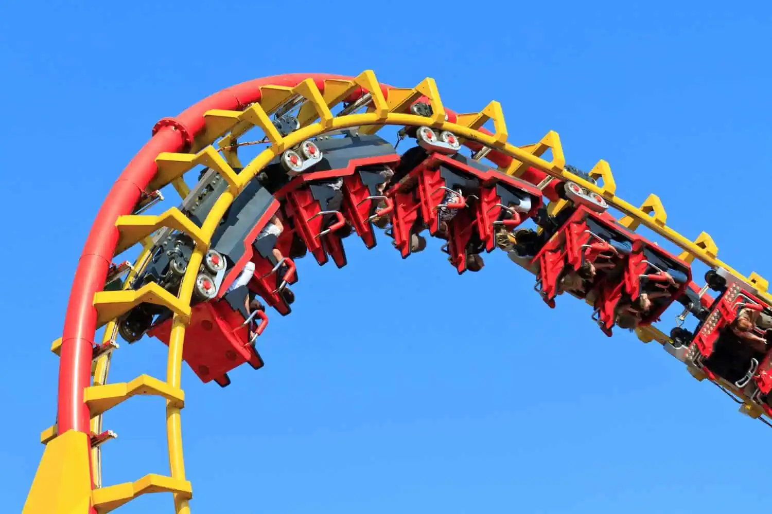 Rollercoaser ride against blue sky