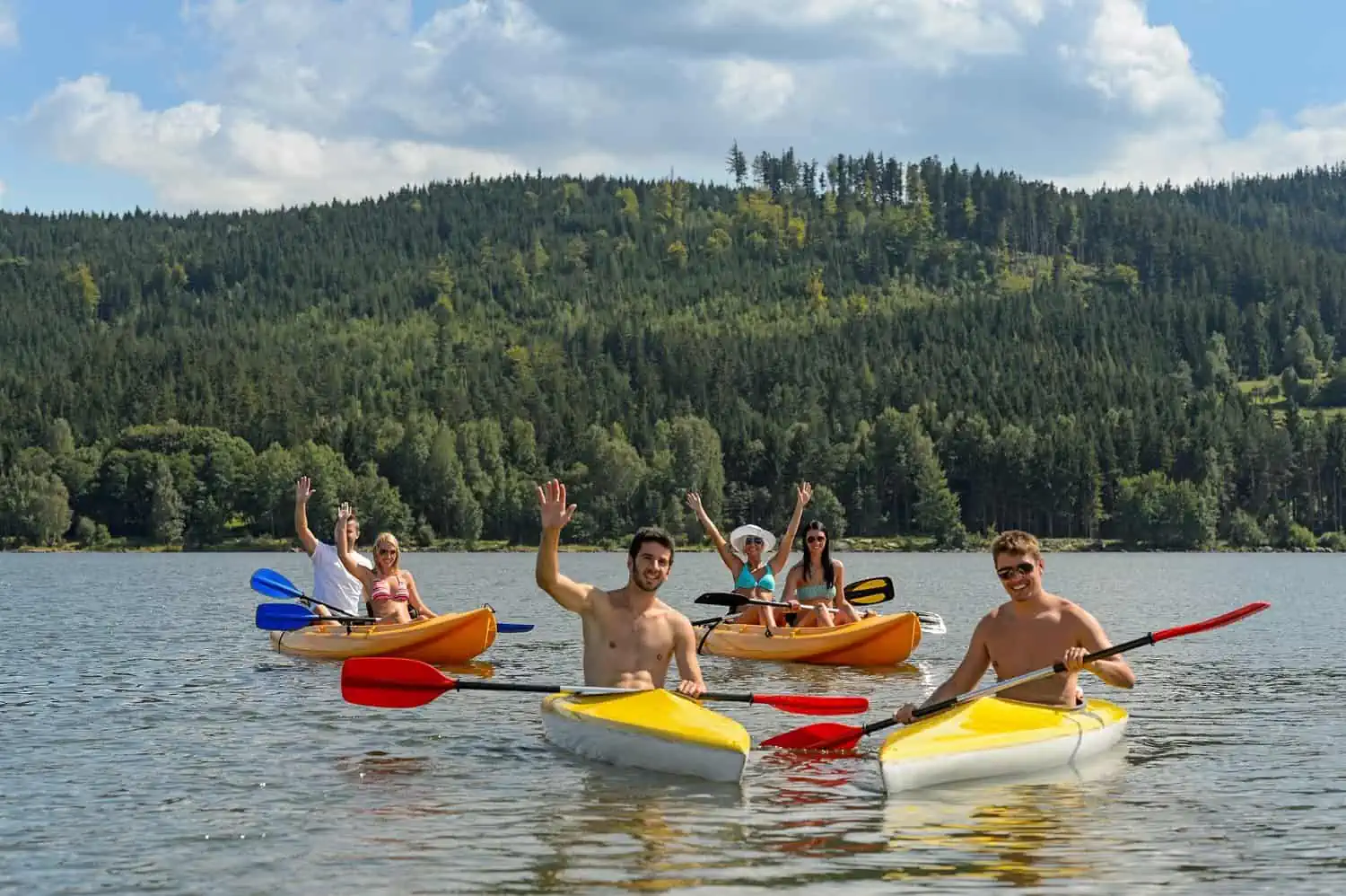 Friends kayaking together in the lake