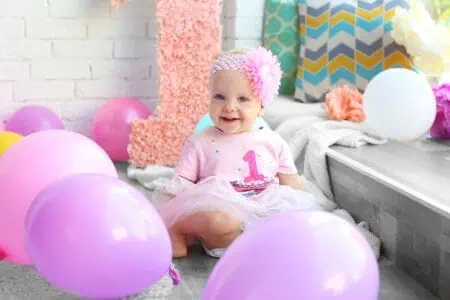 one-year old baby celebrating first birthday