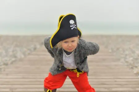 Funny kid wearing pirate costume