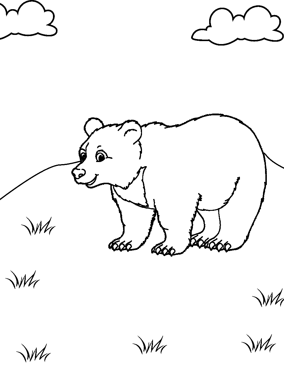 Playful Black Bear Cub Coloring Page - A black bear cub strolling around a grassy hill.