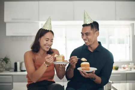 Couple sharing cake for belated birthday