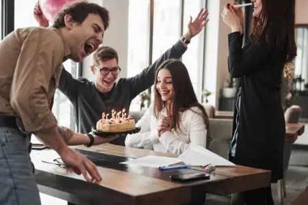 Lady boss celebrating birthday with employees