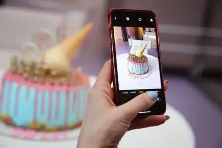 woman taking photo of birthday cake for ex-boyfriend
