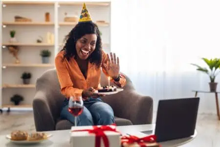 woman celebrating her birthday long distance on video call