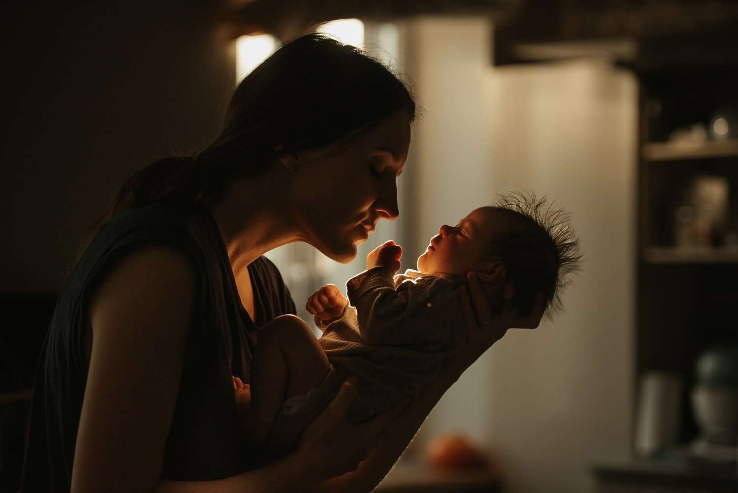 Mother carrying her infant baby