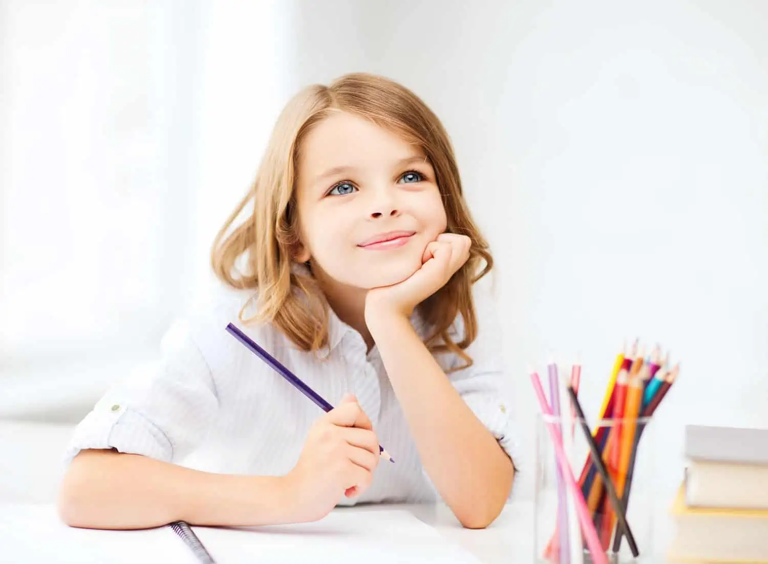 Little girl holding a coloring pen