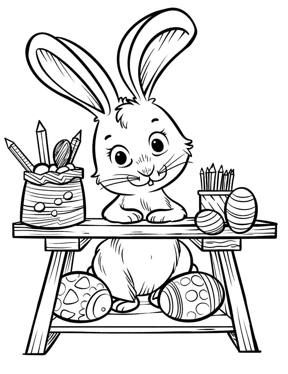 Easter Egg Crafting Table Bunny Coloring Page - A bunny sitting at a crafting table full of tools for decorating Easter eggs, looking creatively inspired.