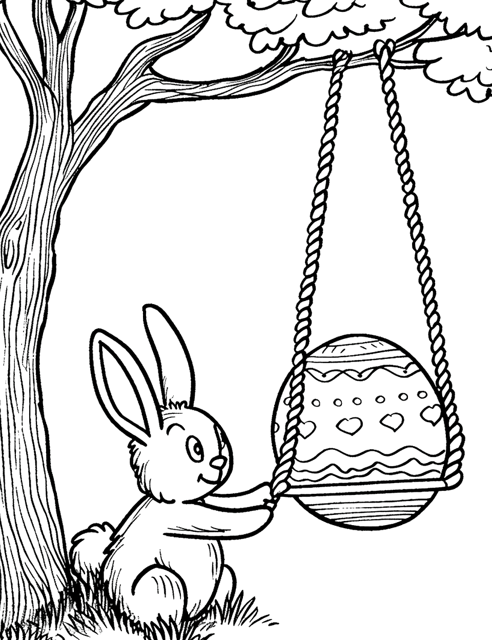 Easter Egg on a Swing Bunny Coloring Page - A bunny gently pushing an Easter egg on a swing, under a tree.